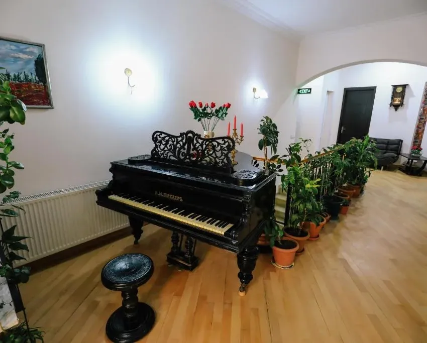The piano in the shared space on the hotel's second floor